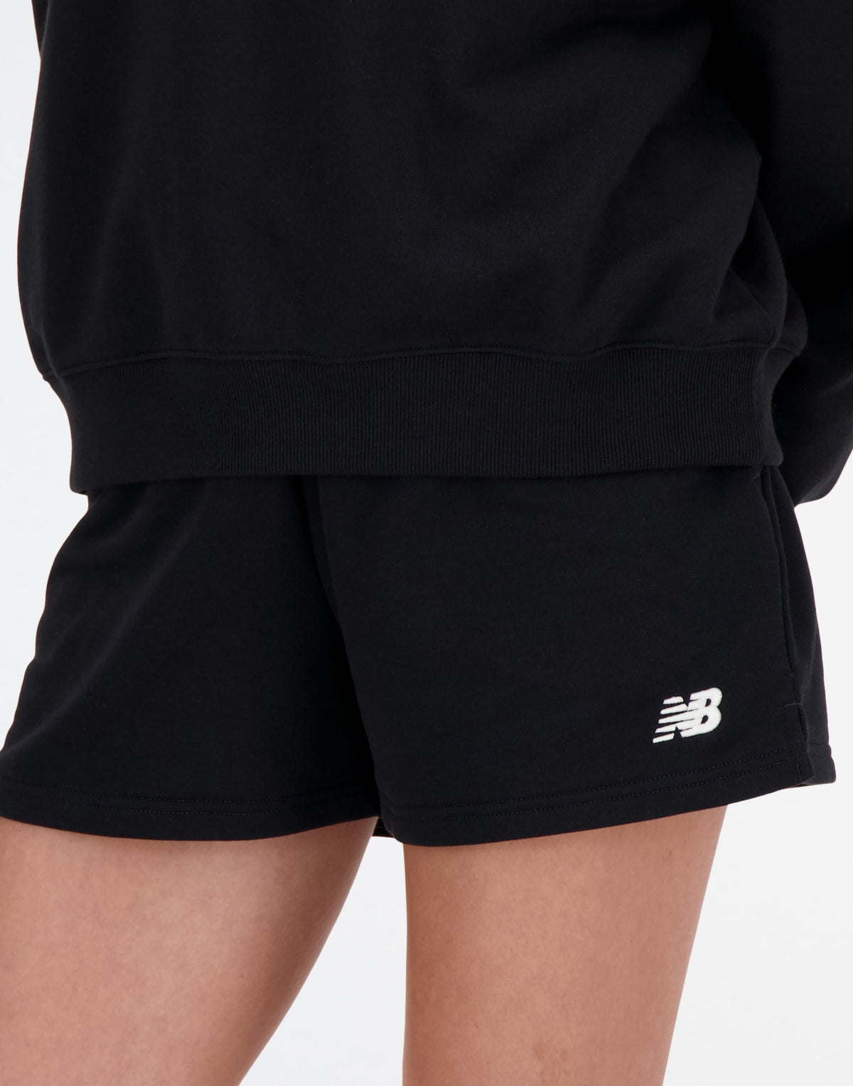 NEW BALANCE Shorts Sport Essentials in French Terry Nero